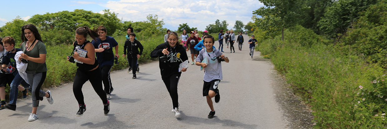 youngsters run on trail at Tommy Thompson Park